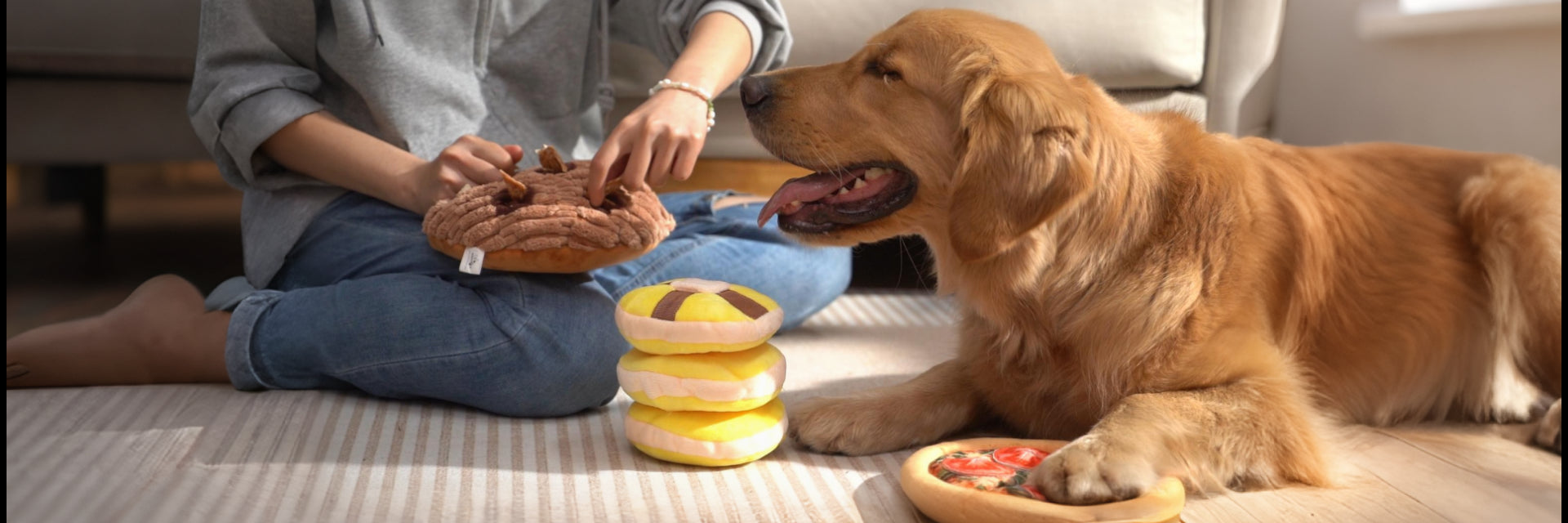 Dog playing with enrichment toys that promote sniffing, searching, and rewarding during snack time.